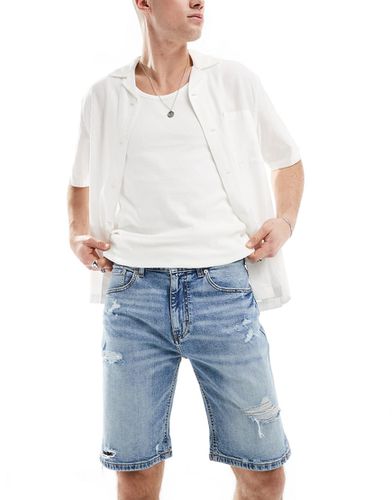 Pantaloncini di jeans slim con strappi - Pull & Bear - Modalova