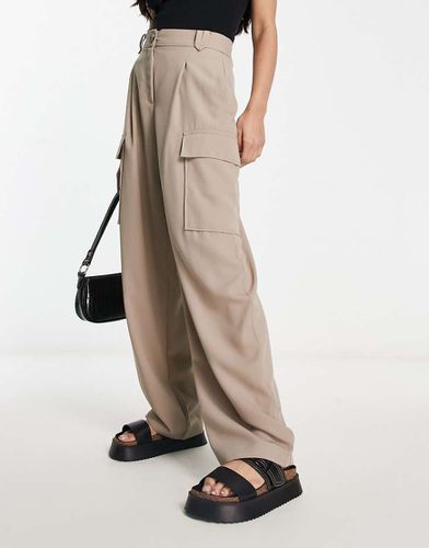 Pantaloni a fondo ampio cargo multitasche beige - River Island - Modalova