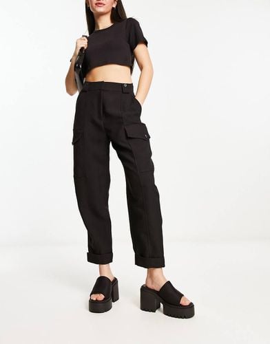 Pantaloni multitasche neri con pinces - River Island - Modalova