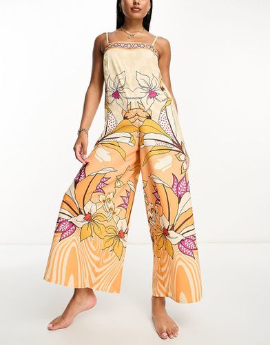 Tuta jumpsuit da mare a fondo ampio con stampa tropicale - River Island - Modalova