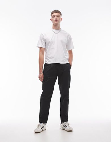 Pantaloni affusolati neri con pieghe doppie - Topman - Modalova