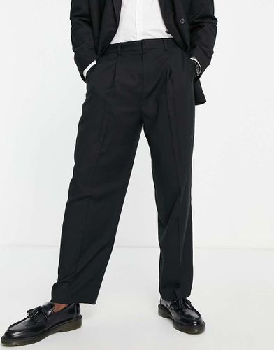 Pantaloni da abito con fondo ampio e pieghe neri - Topman - Modalova