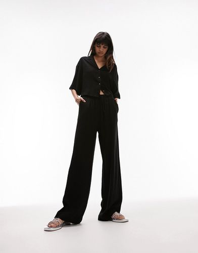 Pantaloni comodi a fondo ampio effetto lino nero in coordinato - Topshop - Modalova