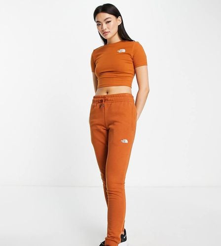 Joggers skinny marroni - In esclusiva per ASOS - The North Face - Modalova