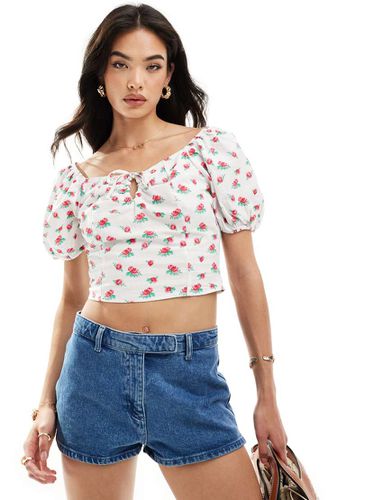 Blusa con scollo a cuore e allacciatura frontale a fiori con maniche a palloncino - Vero Moda - Modalova