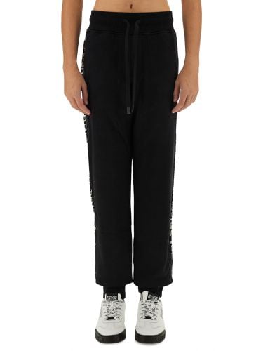 Jogging pants with logo - versace jeans couture - Modalova