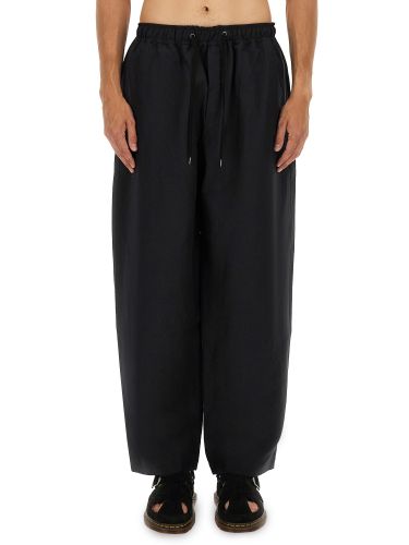 Pants with elastic waistband - studio nicholson - Modalova