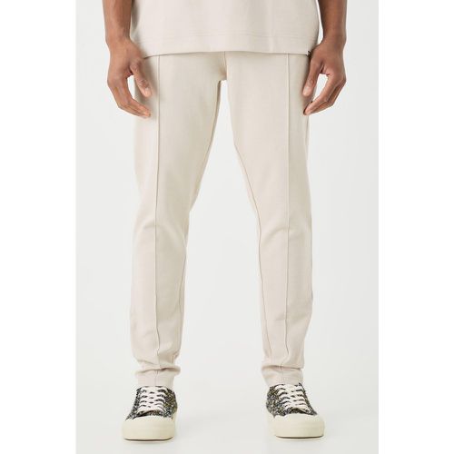 Pantaloni tuta affusolati Slim Fit con nervature e nervature - boohoo - Modalova