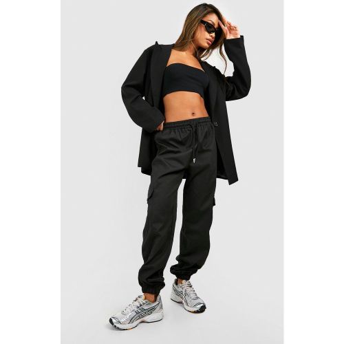 Pantaloni tuta a vita alta con tasche Cargo - boohoo - Modalova