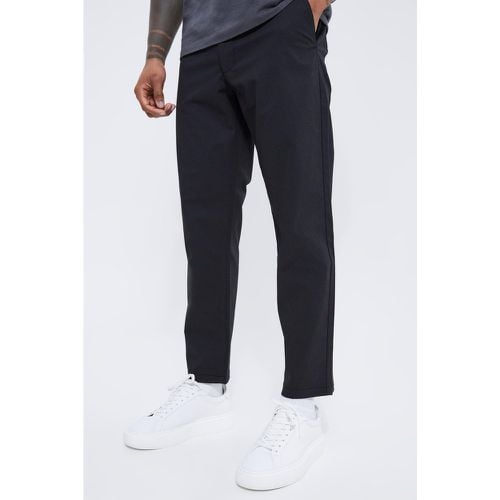 Pantaloni Chino alla caviglia Slim Fit con trama e vita fissa - boohoo - Modalova