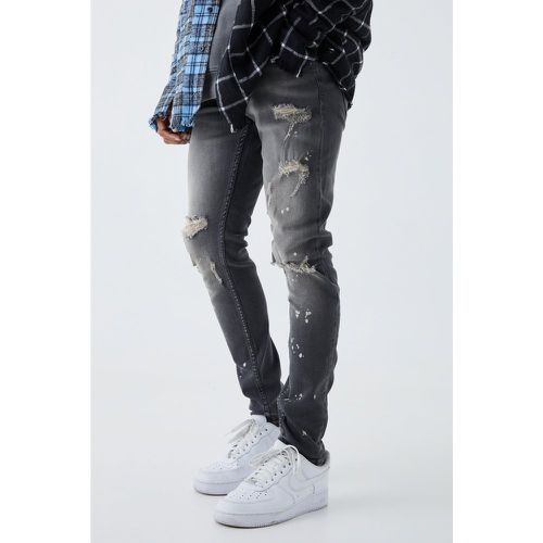 Jeans Skinny Fit Stretch candeggiati con strappi sul ginocchio - boohoo - Modalova