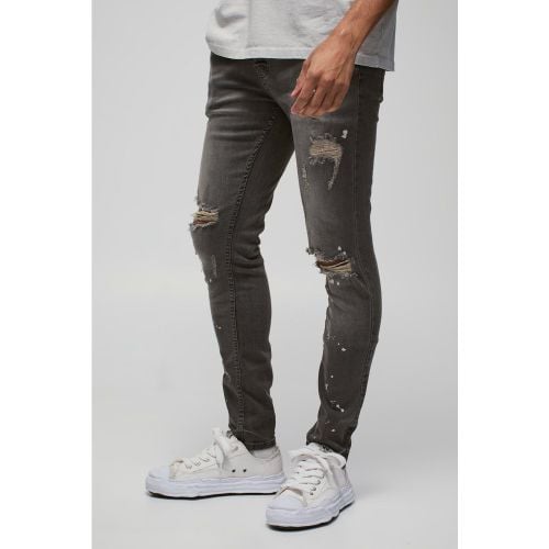 Jeans Skinny Fit Stretch candeggiati con strappi sul ginocchio - boohoo - Modalova