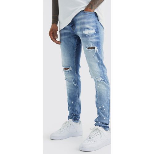 Jeans Skinny Fit Stretch candeggiati con strappi sul ginocchio - boohoo - Modalova