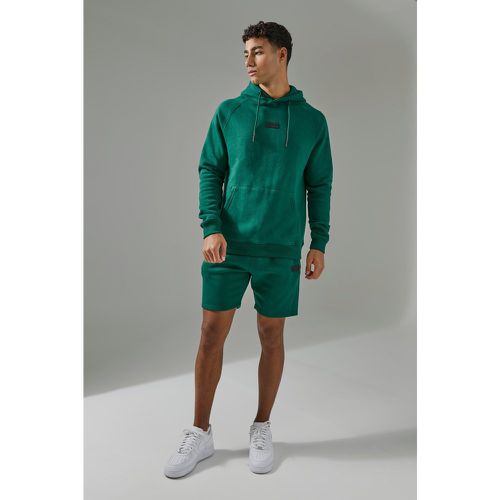 Tuta sportiva Man Active con cappuccio & pantaloncini - boohoo - Modalova