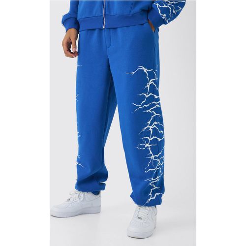 Pantaloni tuta oversize stile Graffiti con zip - boohoo - Modalova