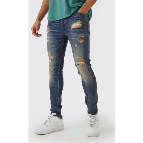 Jeans Skinny Fit in Stretch con strappi - boohoo - Modalova