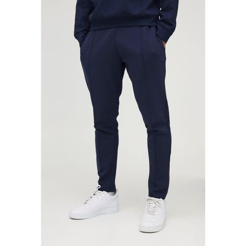 Pantaloni tuta Slim Fit affusolati pesanti Super Clean in maglia interlock - boohoo - Modalova