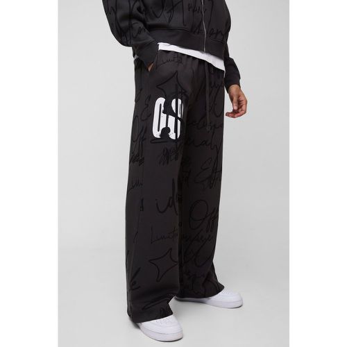 Pantaloni tuta a gamba ampia con stampa stile Graffiti - boohoo - Modalova