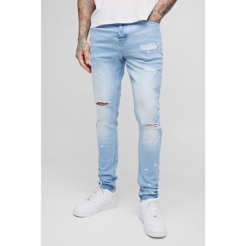 Jeans Tall Skinny Fit strappati all over candeggiati con schizzi di colore - boohoo - Modalova