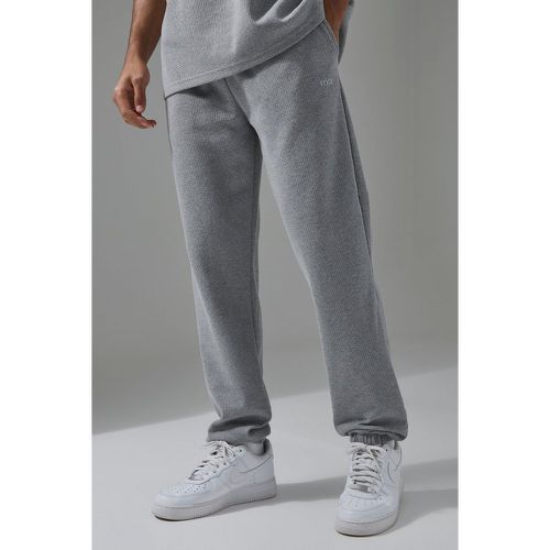 Pantaloni tuta Man Sport Regular Fit con trama a nido d'ape - boohoo - Modalova