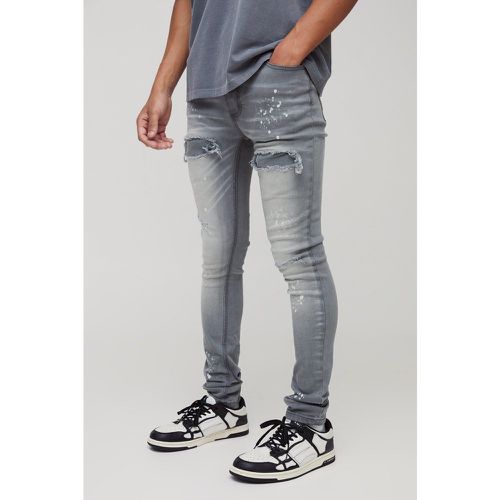 Jeans Super Skinny Fit in denim candeggiato con strappi - boohoo - Modalova