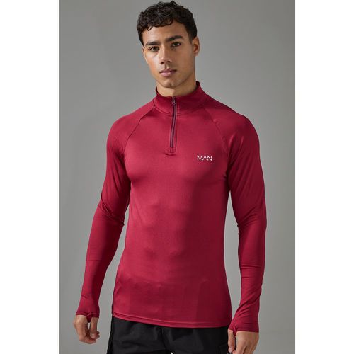 Top attillato Man Active Gym con maniche raglan e zip corta - boohoo - Modalova