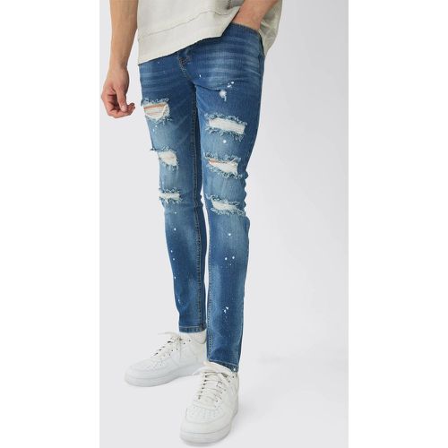 Jeans Skinny Fit in Stretch con strappi & rattoppi e schizzi di colore - boohoo - Modalova