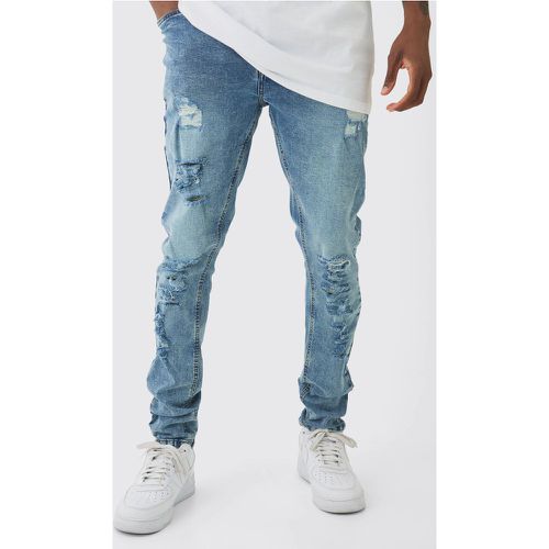 Jeans Tall Skinny Fit con strappi all over - boohoo - Modalova