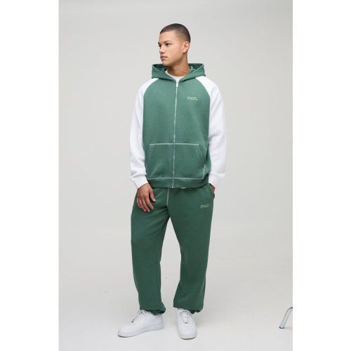 Tuta sportiva oversize Man a blocchi di colore con zip e cappuccio - boohoo - Modalova