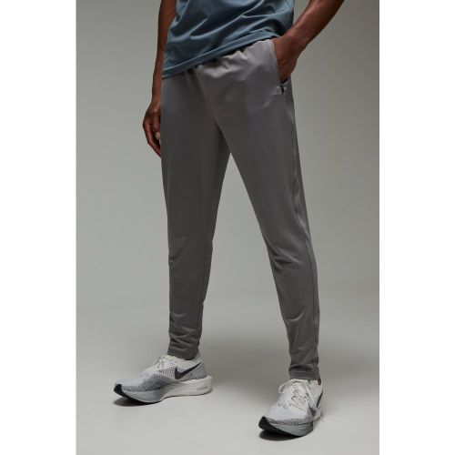 Pantaloni tuta affusolati Man Active per alta performance in Stretch - boohoo - Modalova