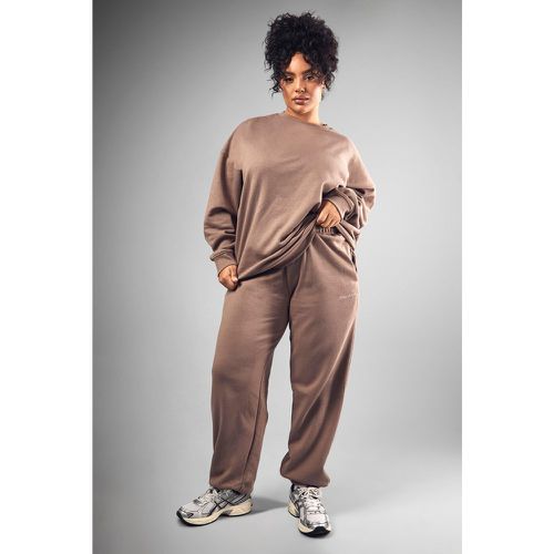 Pantaloni tuta Plus Size oversize con ricami Dsgn Studio e polsini alle caviglie - boohoo - Modalova