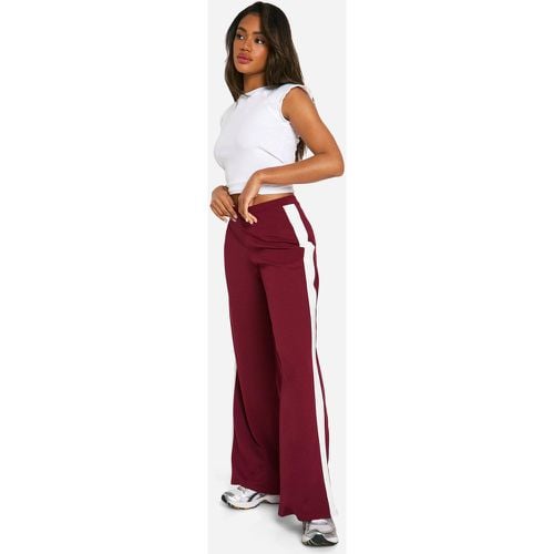 Pantaloni a gamba ampia con righe laterali - boohoo - Modalova