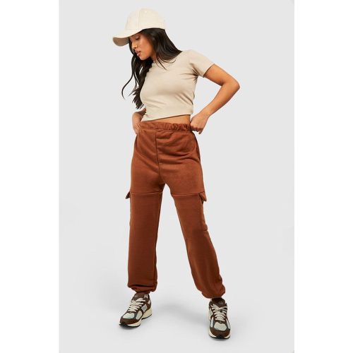 Pantaloni tuta Petite con tasche Cargo - boohoo - Modalova