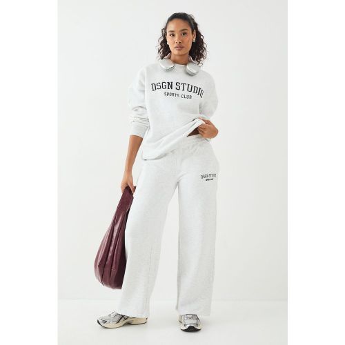 Pantaloni tuta dritti con applique Dsgn Studio - boohoo - Modalova