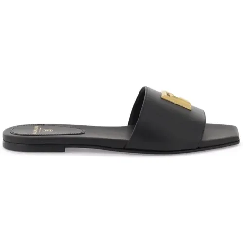 Dafne Slides aus glattem Leder mit goldfarbenem Metallmonogramm - Balmain - Modalova