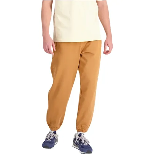 Solid color jumpsuit with ribbed cuffs , male, Sizes: M, S, L - New Balance - Modalova