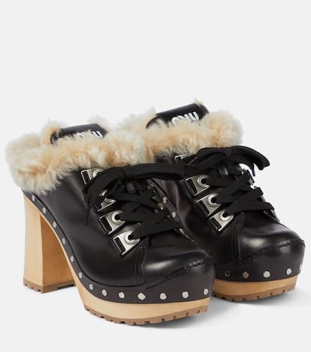 Mules aus Leder und Shearling - Miu Miu - Modalova