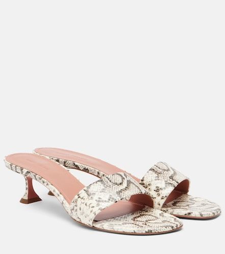 Andreea snake-print leather mules - Amina Muaddi - Modalova