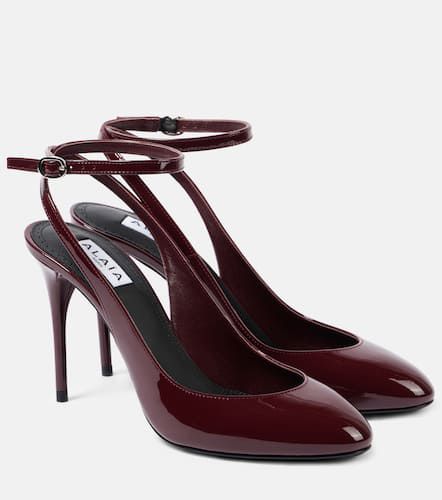 AlaÃ¯a DÃ©colletÃ© 90 patent leather pumps - Alaia - Modalova