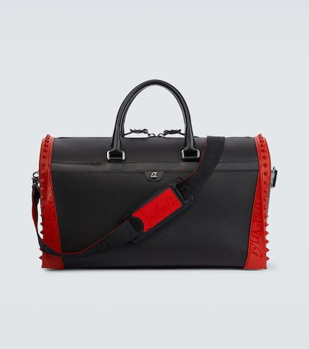 Sneakender spiked leather duffel bag - Christian Louboutin - Modalova