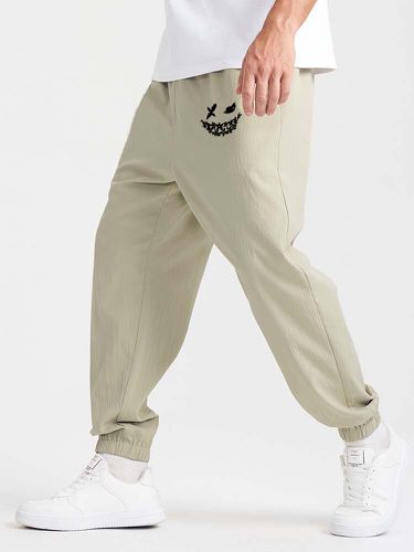 Mens Smile Face Print Elastic Cuff Loose Casual Pants - ChArmkpR - Modalova