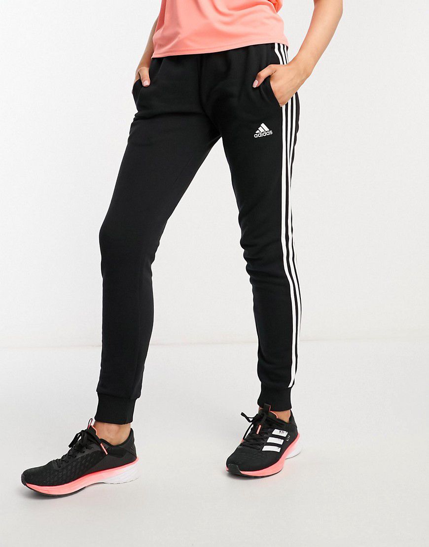 Adidas - Sportswear Essentials - Joggers neri e bianchi con 3 strisce - adidas performance - Modalova