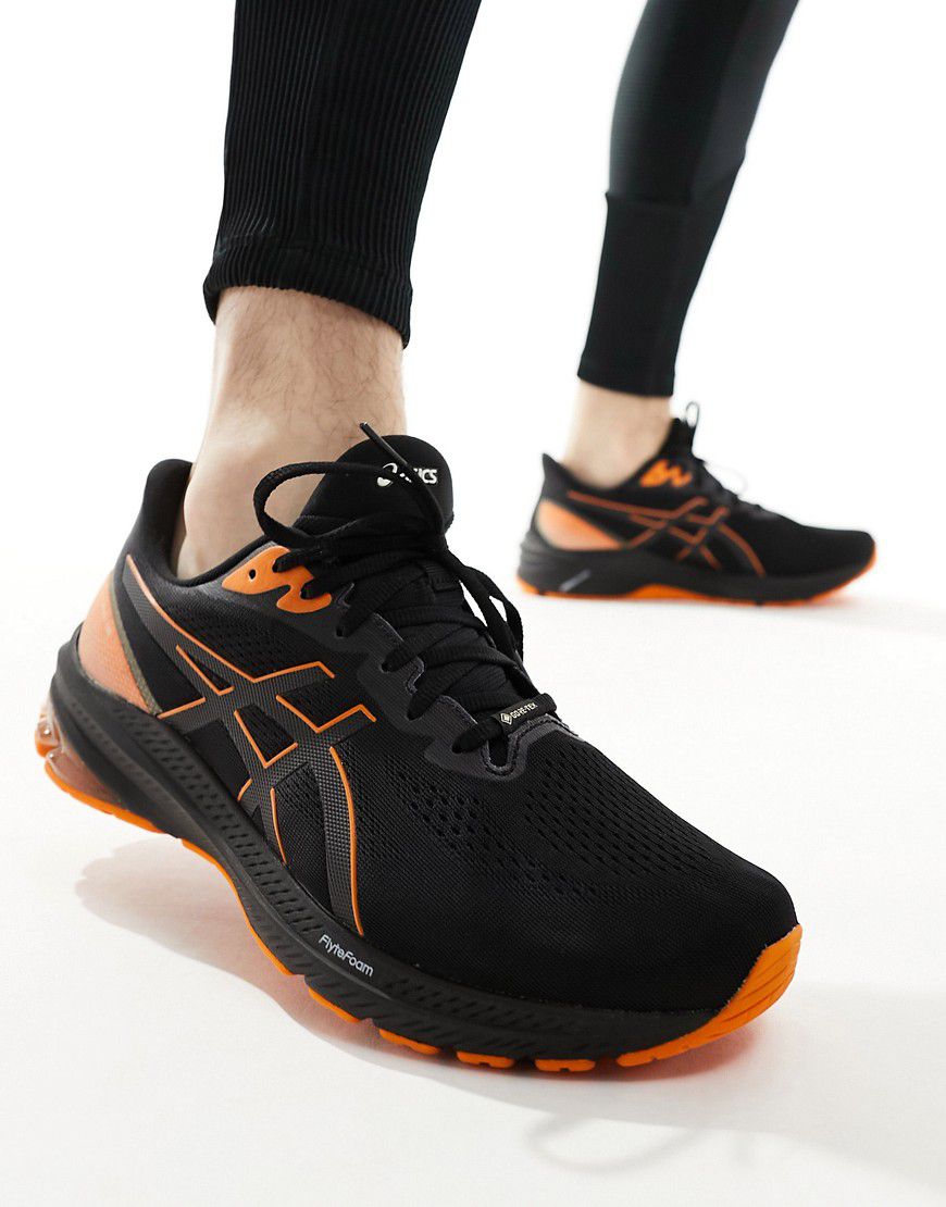 GT-1000 12 GTX Stability - Sneakers da corsa nere e arancioni - Asics - Modalova