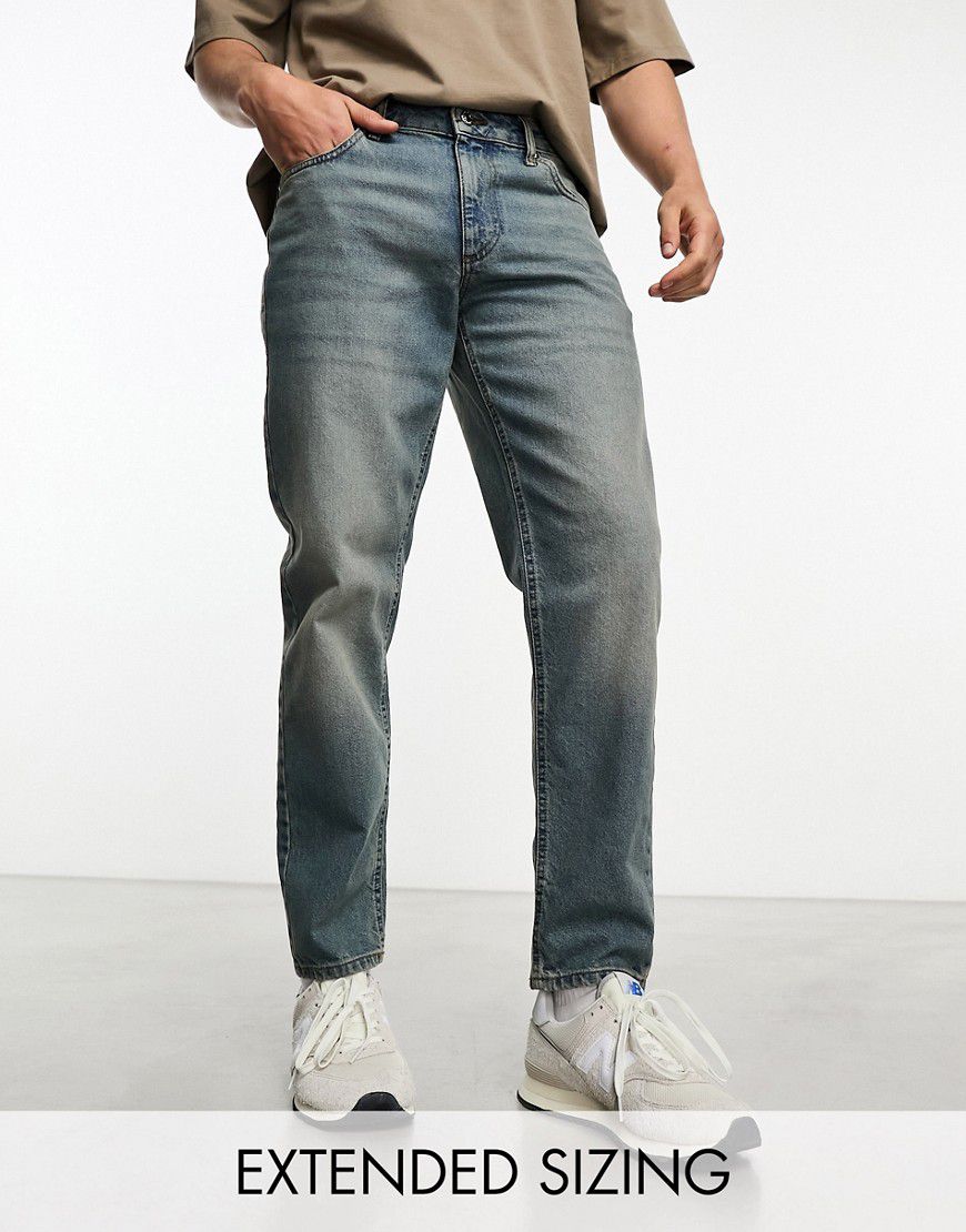 Jeans classici rigidi tintura vintage chiara - ASOS DESIGN - Modalova