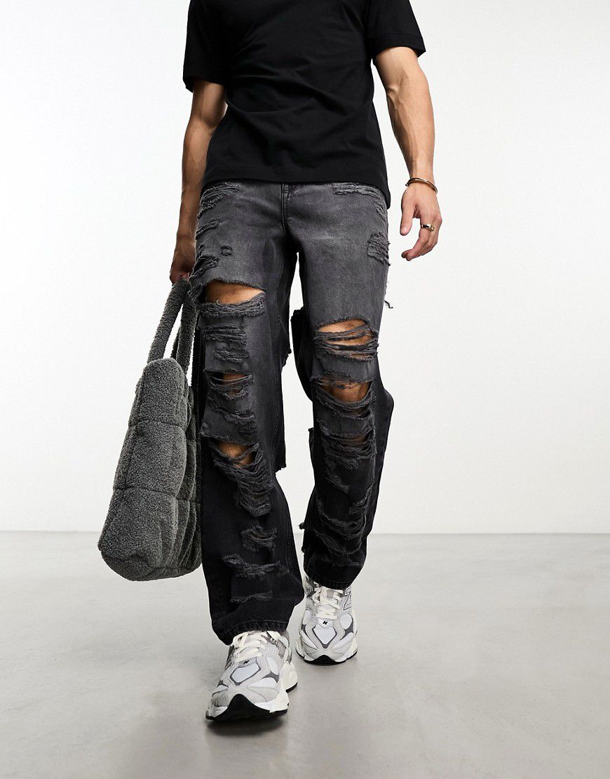Jeans ampi neri con dettagli strappati - ASOS DESIGN - Modalova