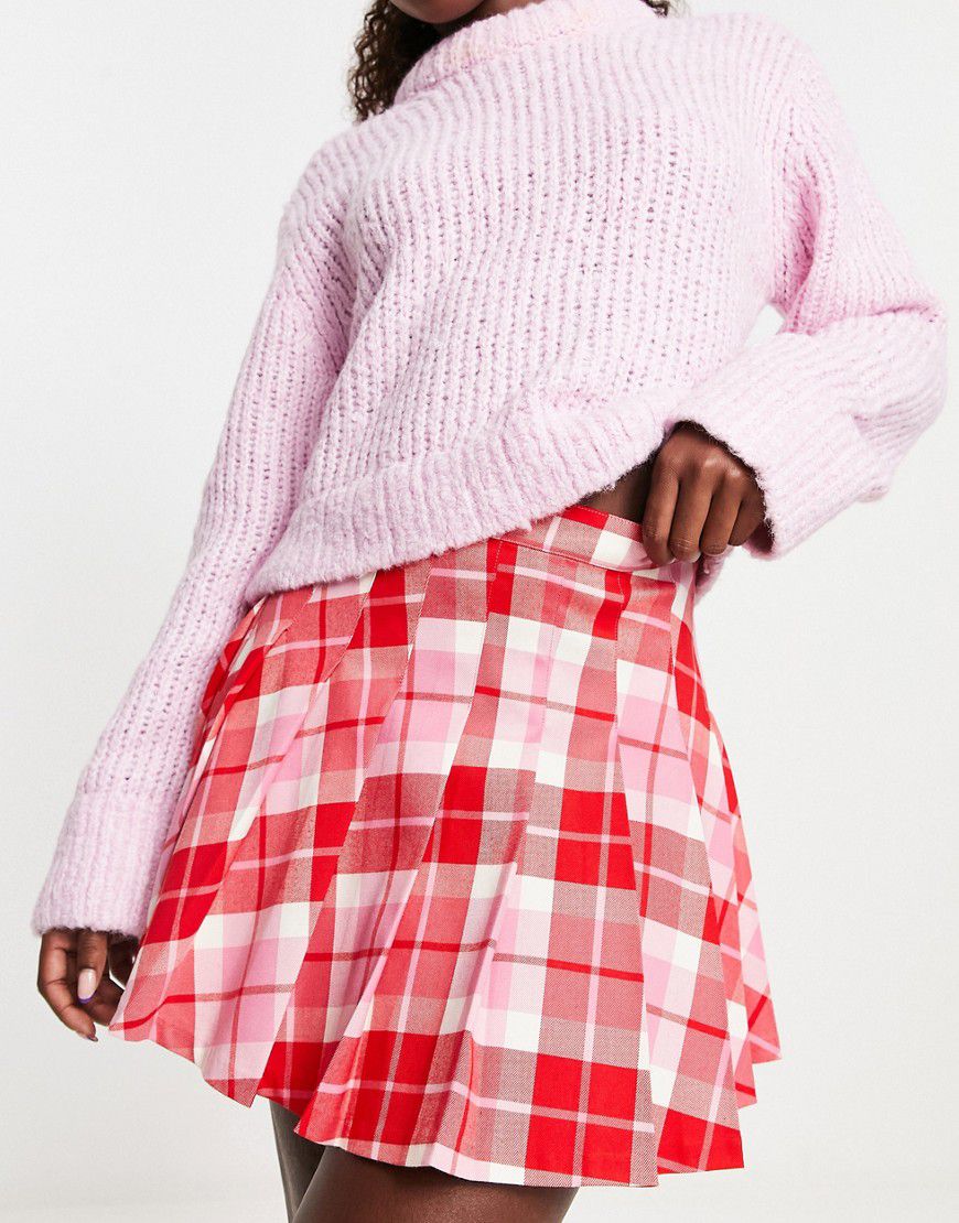 Minigonna a pieghe stile kilt rosa e rossa a quadri - Monki - Modalova
