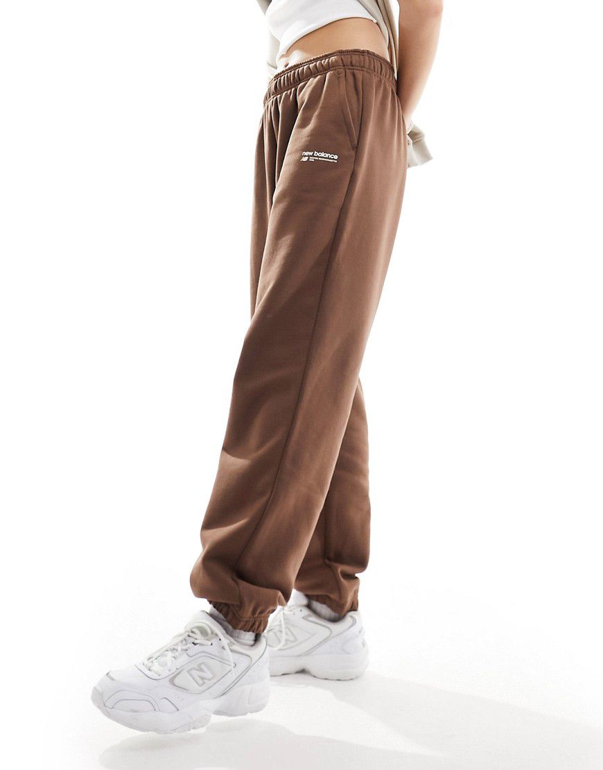 Heritage - Pantaloni della tuta marroni in pile spazzolato con logo lineare - New Balance - Modalova