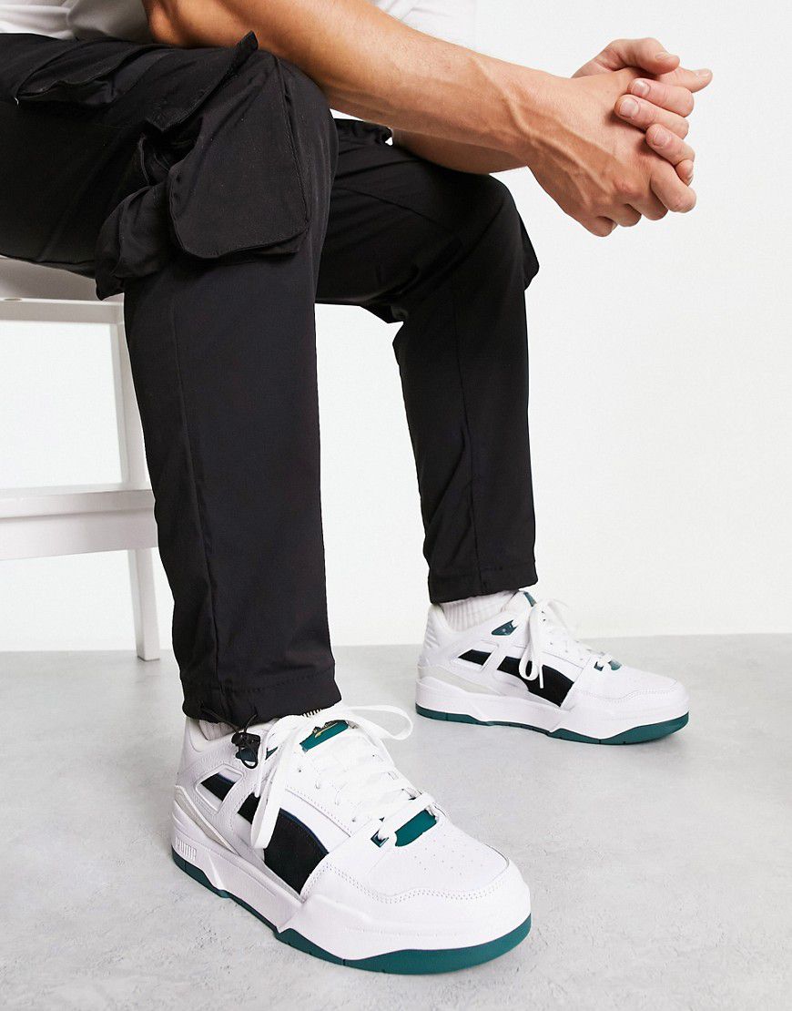 Slipstream - Sneakers bianche e nere con dettagli in camoscio verde - Puma - Modalova
