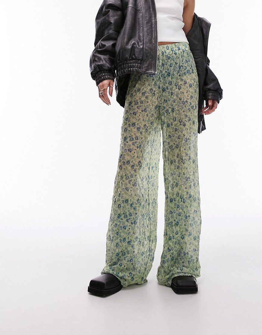 Pantaloni in tessuto stropicciato verdi a fiorellini - Topshop - Modalova