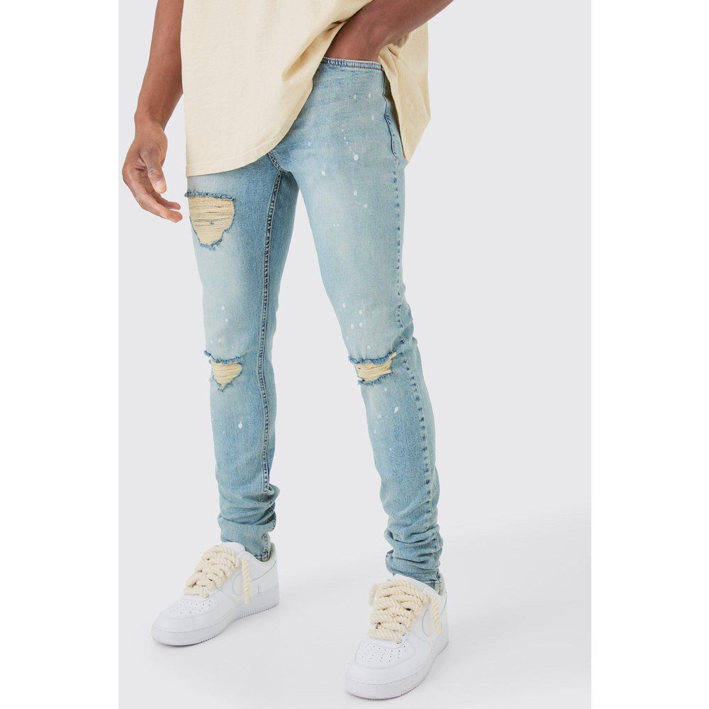 Skinny Stretch Stacked Ripped Paint Splatter Jeans In Ice Blue - boohoo - Modalova